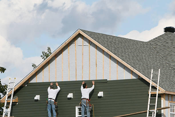 Professional Storm Damage Siding Repair technician working in Rock Hall, MD